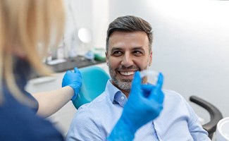 Man attending Invisalign check-in with his dentist