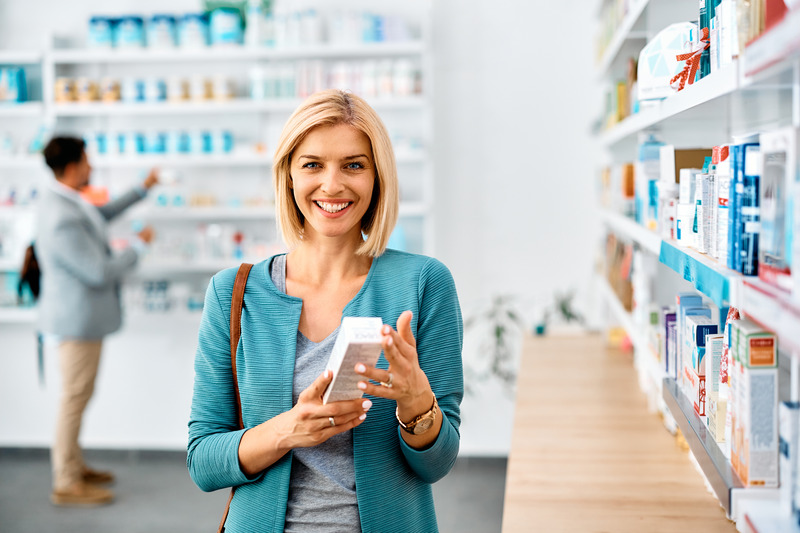 Patient smiling at over-the-counter teeth whitening products